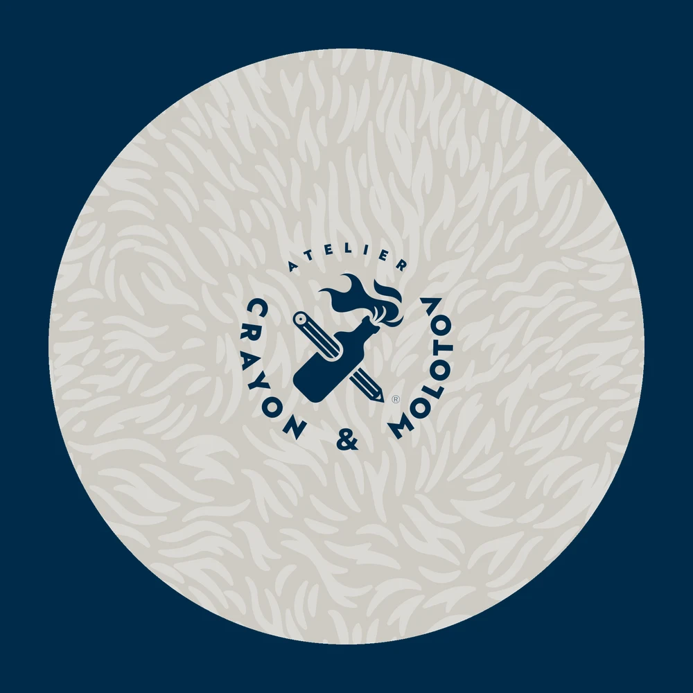 The die-cut sticker: the badge reversed out of the cream flame pattern