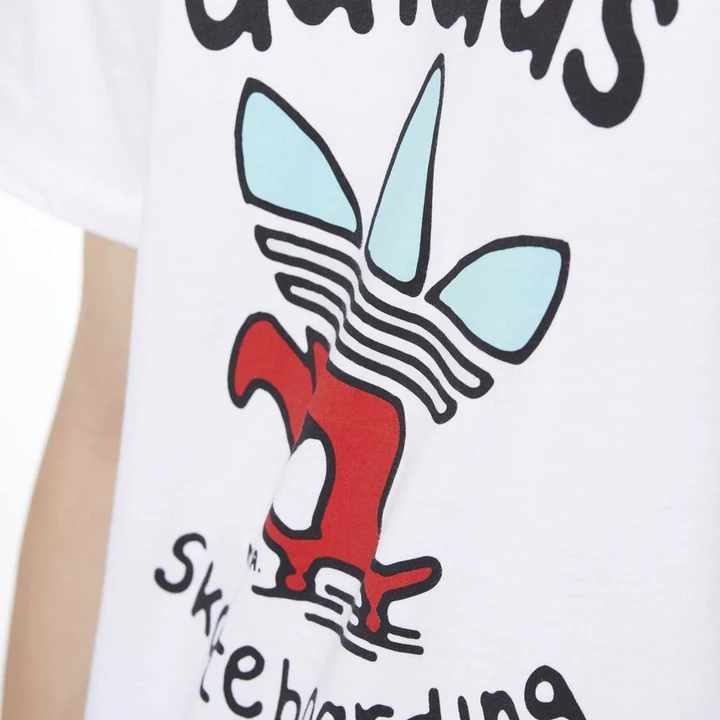 White tee — red trefoil skater, hand-drawn skateboarding lettering