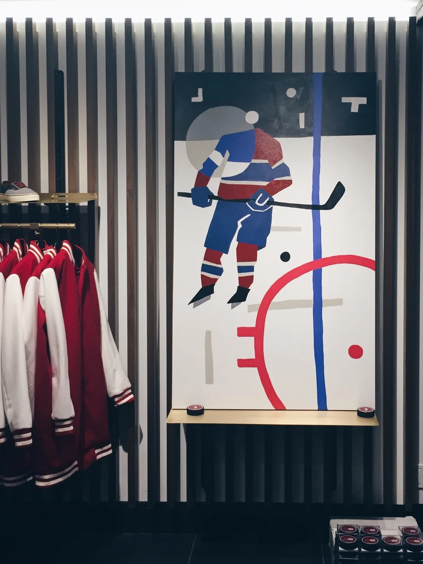 Player mural above the jersey rack at Off the Hook