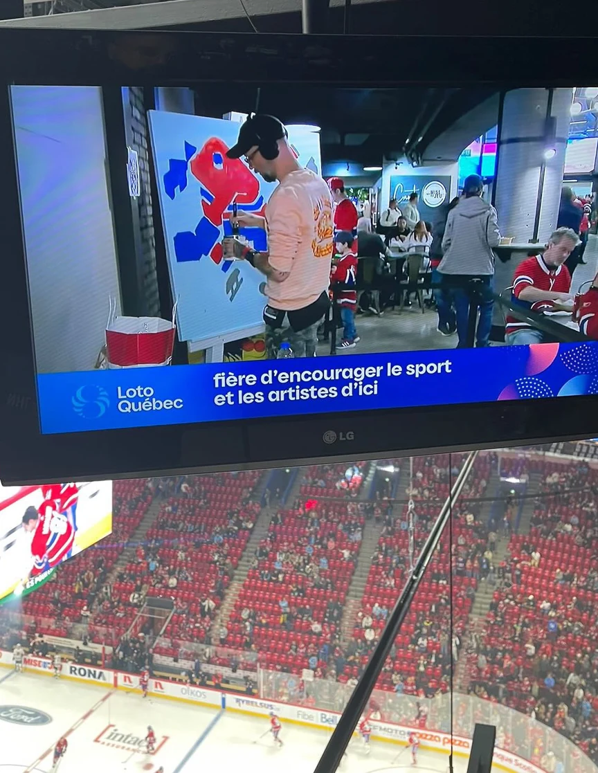 The piece carried on the arena broadcast, seats filling behind