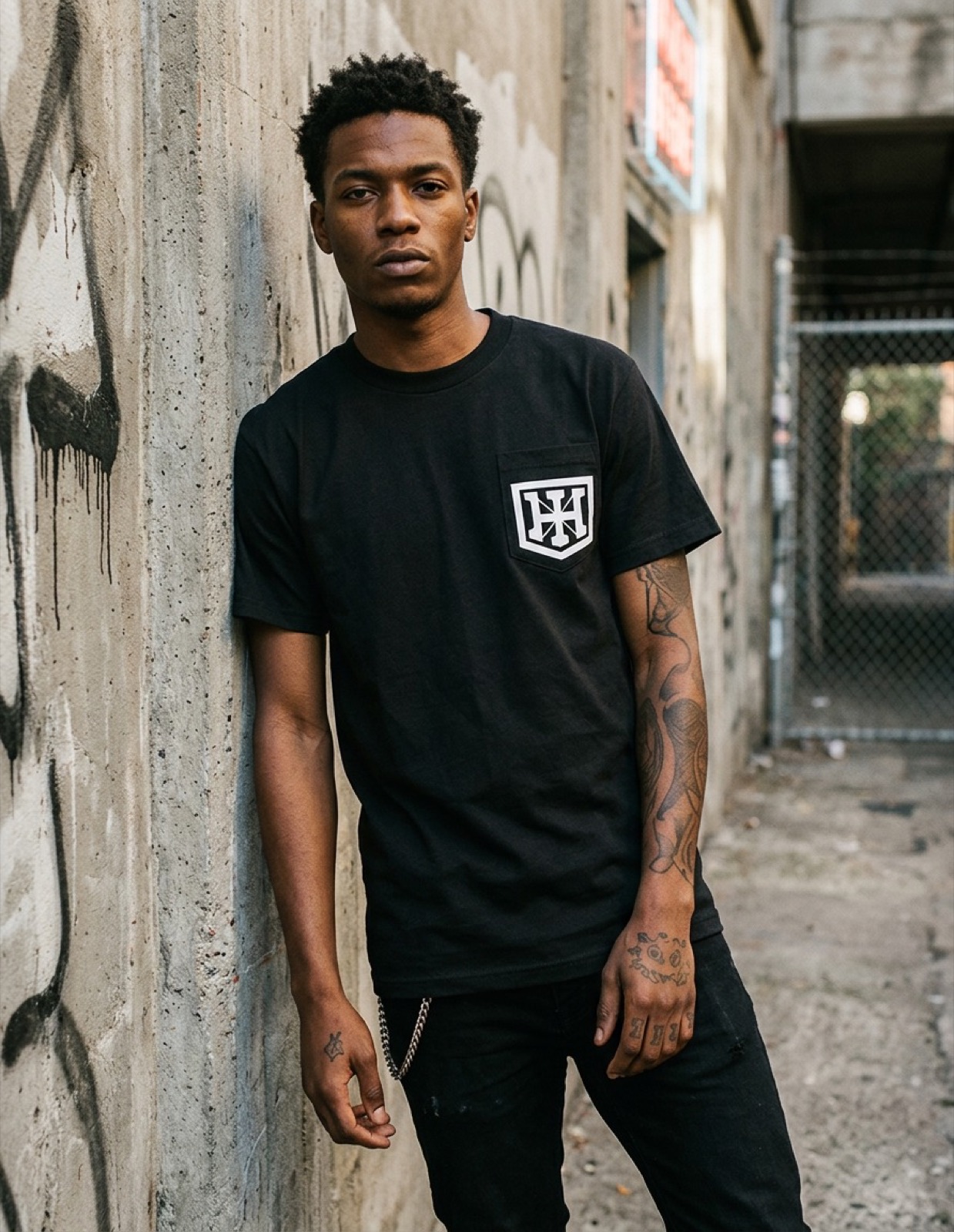 Pocket crest tee worn in the alley