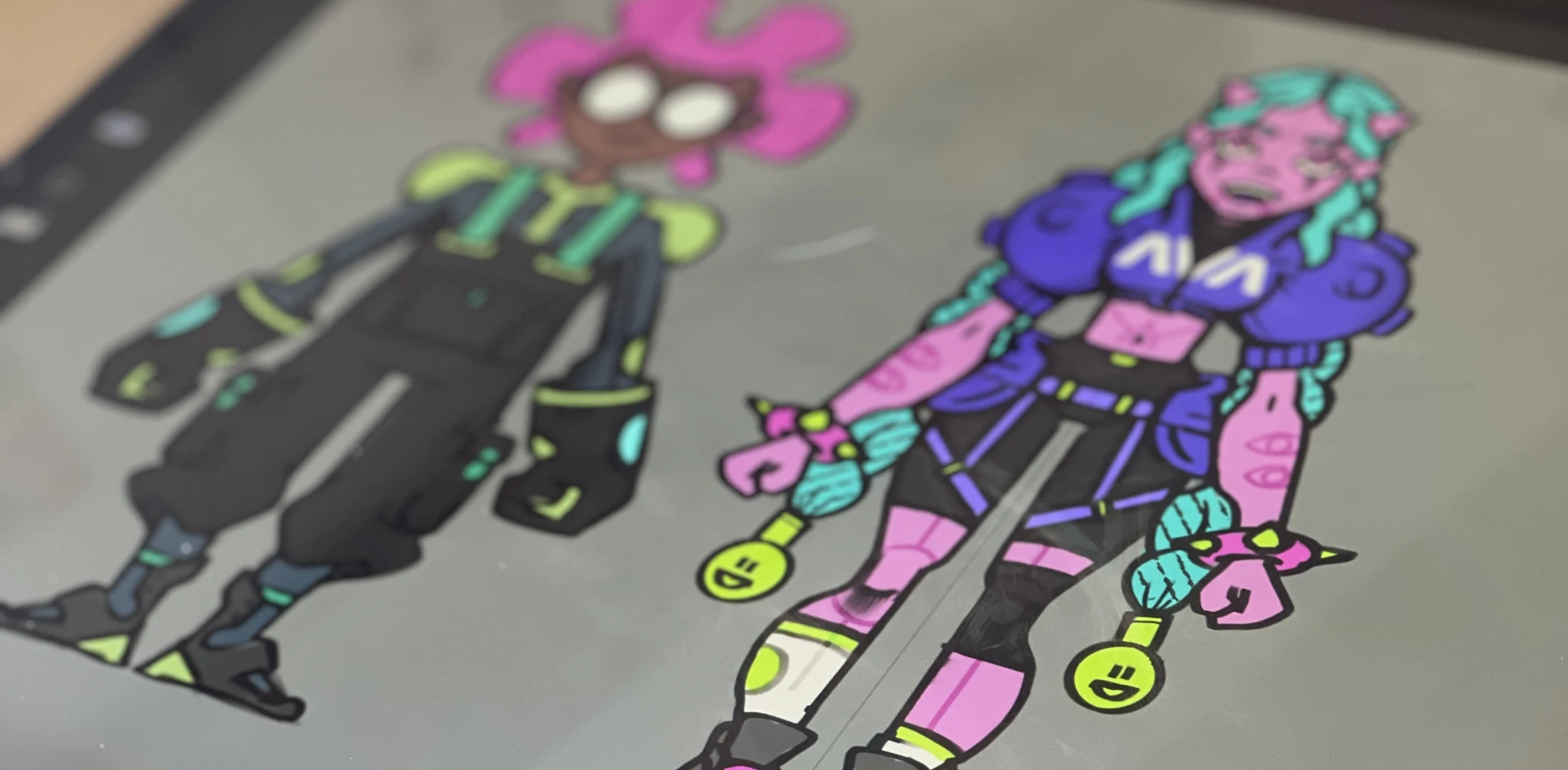 Two of the cast side by side on screen, colour pass