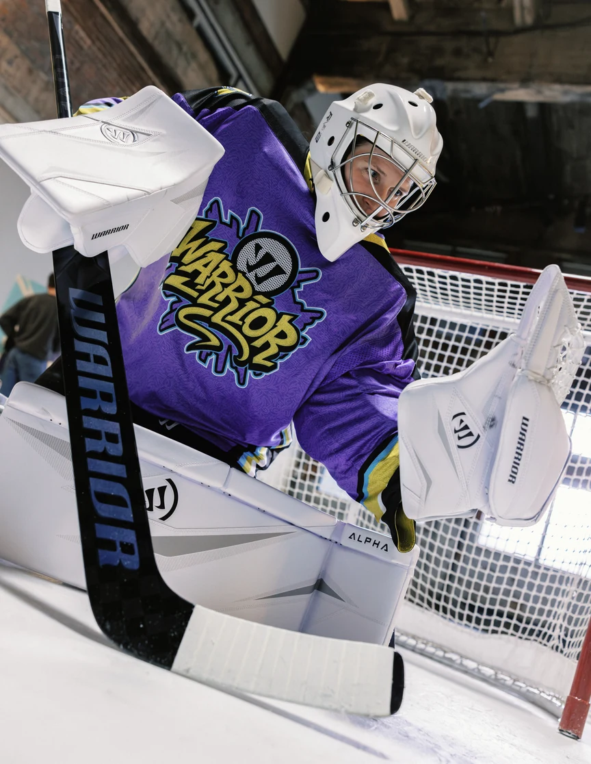 The goalie in Alpha Surge pads in the crease, glove up